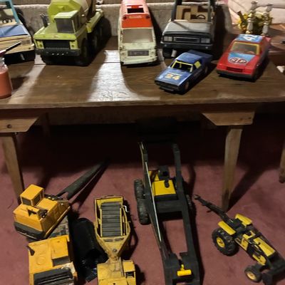 Sale Photo Thumbnail #184: Collection of vintage Tonka and Buddy L toy vehicles, including construction equipment, race cars, and trucks.