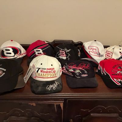 Sale Photo Thumbnail #200: Collection of vintage racing and motorcycle baseball caps, featuring Dale Earnhardt, Dale Earnhardt Jr., Harley-Davidson, and Don Garlits designs.