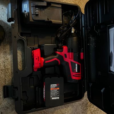 Sale Photo Thumbnail #153: Earthquake XT cordless impact wrench set in original hardshell case with battery pack and charger.