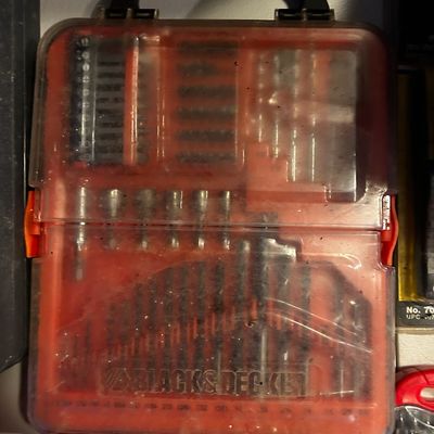 Sale Photo Thumbnail #12: Black & Decker drill bit and driver set in a clear plastic carrying case showing light use.
