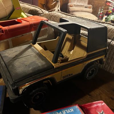 Sale Photo Thumbnail #129: Vintage Tonka black and yellow Bronco toy truck, showing age-appropriate wear and play use.