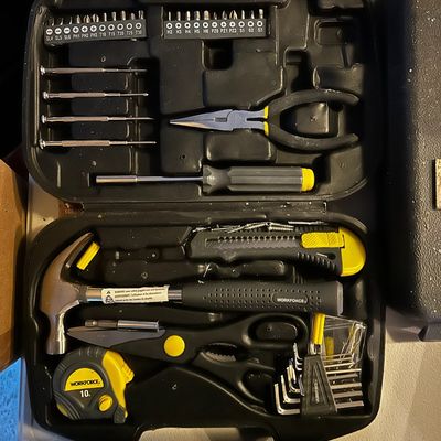Sale Photo Thumbnail #14: Workforce household tool set in a black blow-molded carrying case, including a hammer, tape measure, pliers, utility knife, and various driver bits.