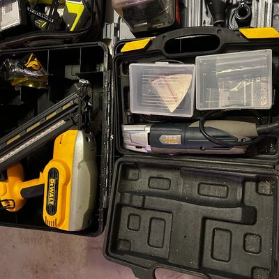 Sale Photo Thumbnail #32: DeWalt cordless framing nailer and an oscillating multi-tool, both housed in heavy-duty molded plastic carrying cases with accessories.