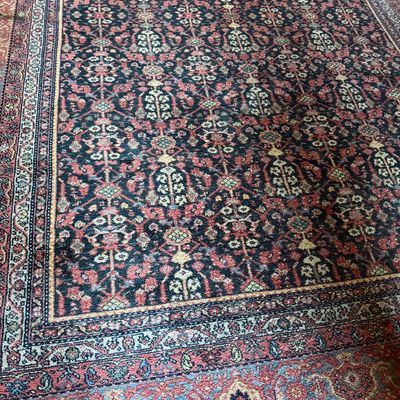 Sale Photo Thumbnail #7: Persian or Oriental style area rug featuring an intricate floral lattice pattern in navy blue, muted red, and cream tones with a detailed multi-band border.