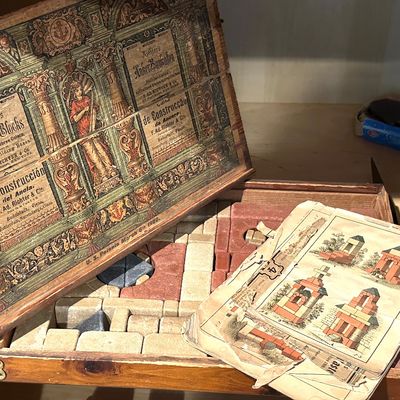 Sale Photo Thumbnail #13: Antique Richter's Anchor Blocks stone building set in a wooden case with original lithographed lid label and instruction booklets, showing US patents through 1900.