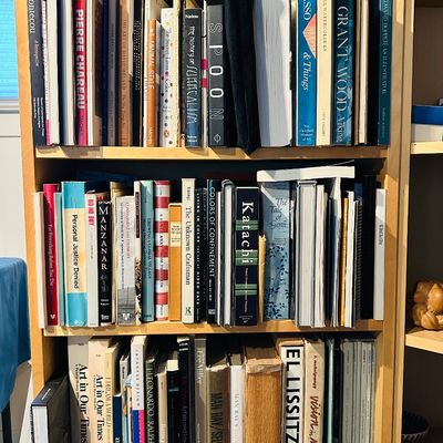 Sale Photo Thumbnail #11: A light wood bookcase filled with three shelves of books, primarily focusing on art history, artists, and design.