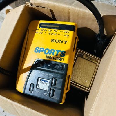 Sale Photo Thumbnail #186: Vintage yellow Sony Sports Walkman cassette player 
