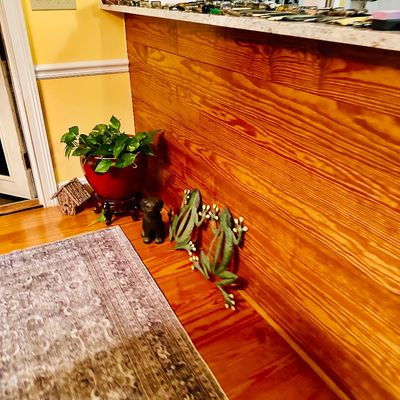 Sale Photo Thumbnail #95: Selection of home decor items featuring metal frog wall art pieces, a small dog figurine, a potted plant in a red ceramic vessel, and a patterned runner rug.