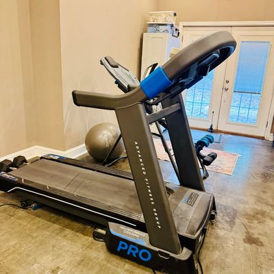 Sale Photo Thumbnail #37: Advanced Fitness Group (AFG) Pro motorized treadmill featuring high-performance cushioning and digital display console.