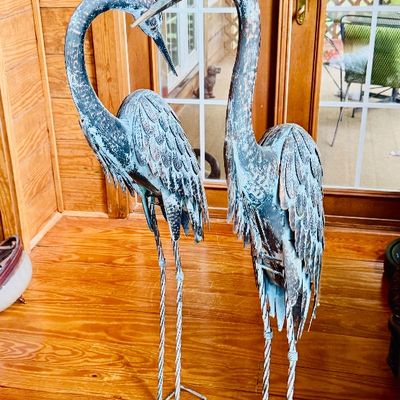 Sale Photo Thumbnail #63: Pair of tall metal heron garden statues featuring a verdigris patina and detailed feather texturing.