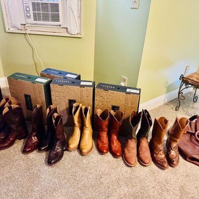Sale Photo Thumbnail #65: Collection of Tecovas men's leather cowboy boots lined up with original boxes and a matching brown leather duffel bag.