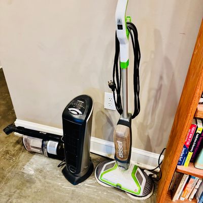 Sale Photo Thumbnail #41: Group of small household appliances including a Bissell SpinWave hard floor mop, a Lasko ceramic tower heater, and a handheld vacuum cleaner.