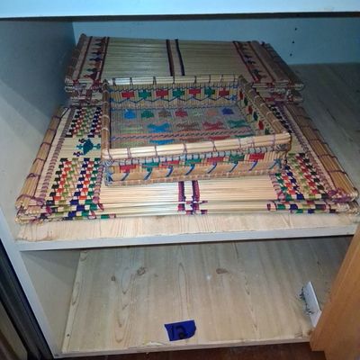 Sale Photo Thumbnail #104: Set of woven bamboo placemats and a matching tray featuring colorful geometric thread accents.