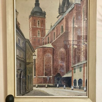 Sale Photo Thumbnail #230: Framed architectural watercolor painting depicting St. Mary's Basilica in Krakow, housed in an off-white wooden frame with beaded inner trim.