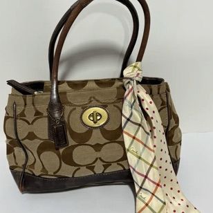 Sale Photo Thumbnail #5: Coach brown signature monogram jacquard canvas tote bag with leather trim, brass turn-lock closure, and an attached patterned silk scarf.