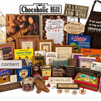 Sale Photo Thumbnail #18: Large collection of chocolate-themed novelty items, including framed art, tin signs, books, decor, and an printed apron.
