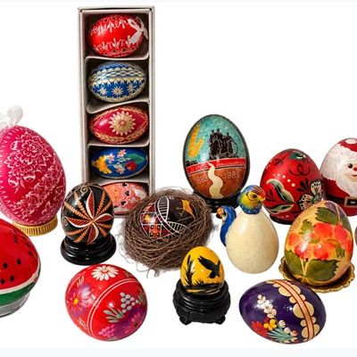 Sale Photo Thumbnail #28: Collection of decorative painted eggs, including traditional Ukrainian pysanky, hand-painted wooden designs, and novelties featuring Santa Claus and watermelon motifs.