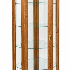 Sale Photo Thumbnail #4: Traditional hexagonal oak curio cabinet featuring glass display shelves and a framed glass door with brass hardware.