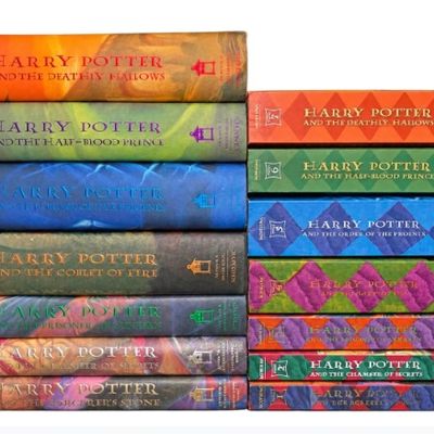 Sale Photo Thumbnail #14: Complete US hardcover set of the Harry Potter book series alongside a matching paperback box set, published by Scholastic.