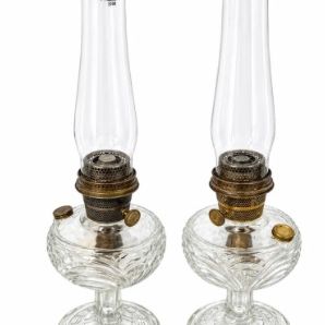 Sale Photo Thumbnail #13: Pair of vintage Aladdin clear glass kerosene lamps with tall glass chimneys and brass burner hardware.