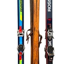 Sale Photo Thumbnail #21: Collection of three single water skis, including modern Dynastar and Rossignol models with bindings alongside a vintage natural wood water ski.