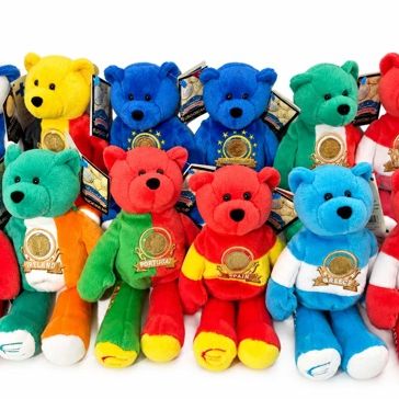 Sale Photo Thumbnail #20: Collection of Euro currency commemorative plush bears representing various European nations, each featuring flag colors and an embedded coin emblem.