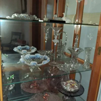 Sale Photo Thumbnail #627: Vintage glassware collection in curio cabinet