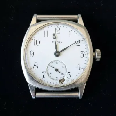 Sale Photo Thumbnail #693: Vintage elgin trench watch