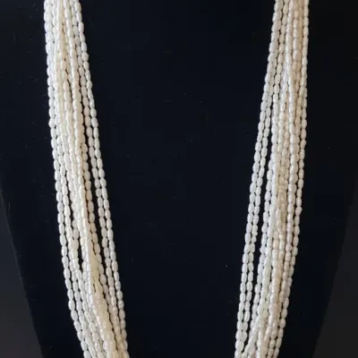 Sale Photo Thumbnail #671: Multi strand rice pearl necklace with k gold clasp