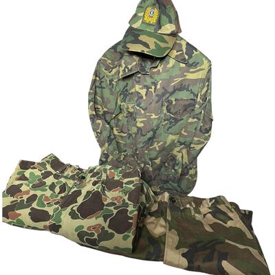Sale Photo Thumbnail #730: An Assortment of Camouflage Military Field Apparel and Accessories