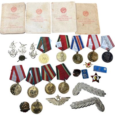 Sale Photo Thumbnail #549: A Collection of Soviet Military Medals, Branch Insignia, and Original Award Documents