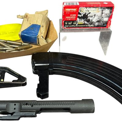 Sale Photo Thumbnail #249: A Collection of Ammunition and Firearm Components Including AR-15 Bolt Carrier Group, SKS Magazine, and Surplus Rifle Cartridges