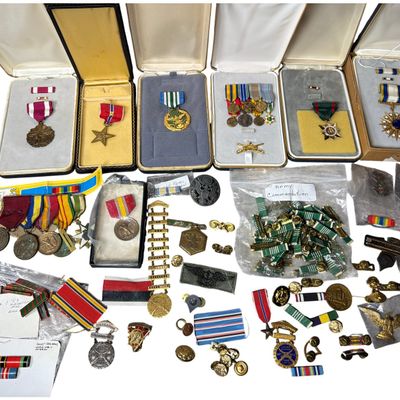 Sale Photo Thumbnail #671: A Collection of United States and International Military Medals, Ribbons, and Insignia