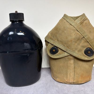 Sale Photo Thumbnail #349: U.S. WWII S.M. Co. 1942 Black Enamel Steel Canteen and Canvas Cover