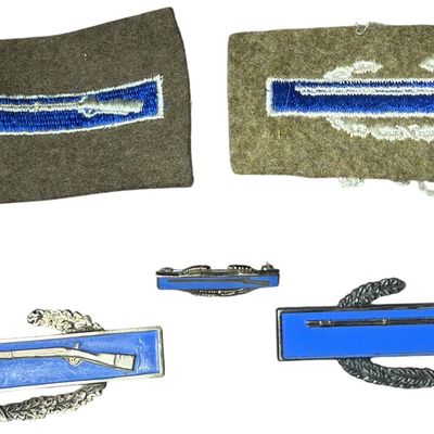 Sale Photo Thumbnail #325: A Group of United States Army Infantry Insignia Including Sterling Silver Combat Infantryman Badges