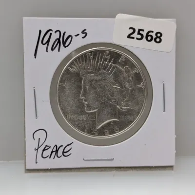 Sale Photo Thumbnail #893: 1926-S Peace silver dollar stored in a cardboard coin flip holder.
