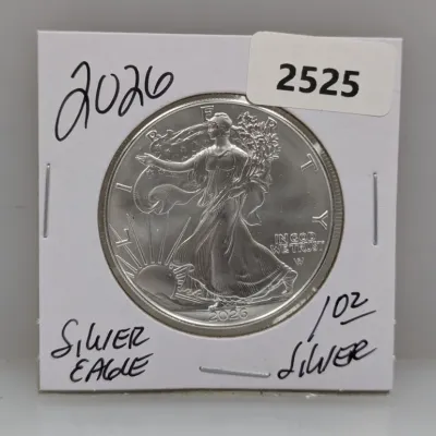 Sale Photo Thumbnail #850: American Silver Eagle 1 oz silver bullion coin, dated 2026, presented in a protective cardboard flip holder.