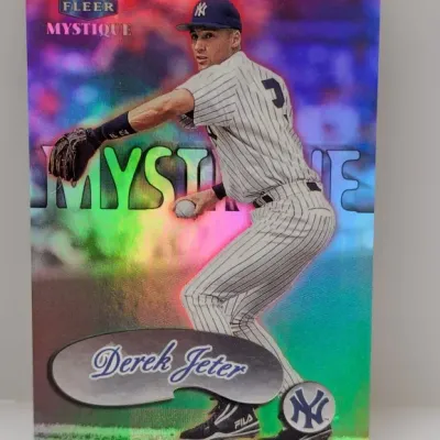 Sale Photo Thumbnail #504: Fleer Mystique Derek Jeter New York Yankees trading card featuring a vibrant holographic finish.