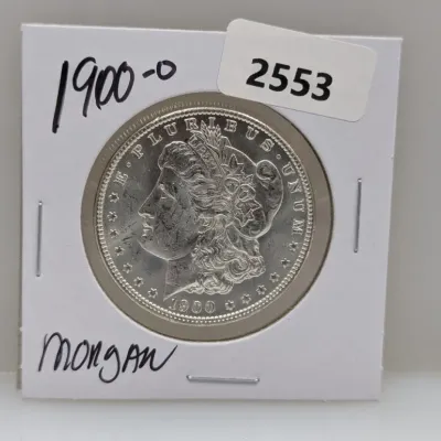 Sale Photo Thumbnail #878: 1900-O Morgan silver dollar displayed in a protective cardboard flip holder.