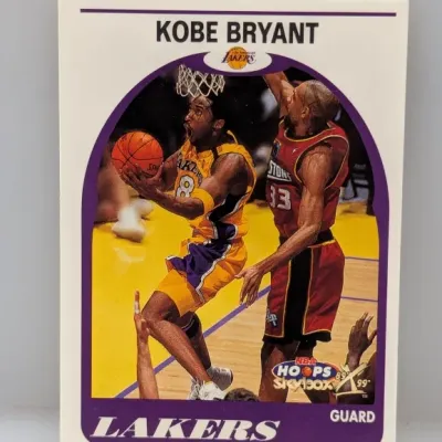 Sale Photo Thumbnail #536: 1998-99 NBA Hoops Kobe Bryant basketball trading card (#10) featuring a retro 1989-90 Hoops design.