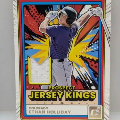 Sale Photo Thumbnail #519: Panini Donruss Prospect Jersey Kings Ethan Holliday trading card featuring an embedded game-worn fabric relic.