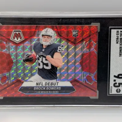 Sale Photo Thumbnail #66: SGC-graded 9.5 Mint 2024 Panini Mosaic Brock Bowers NFL Debut Red Prizm rookie trading card.