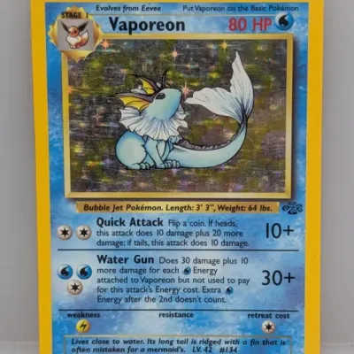 Sale Photo Thumbnail #80: 1999 Pokémon Jungle Unlimited Vaporeon holographic card (12/64), featuring artwork by Kagemaru Himeno.