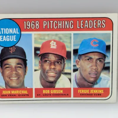 Sale Photo Thumbnail #597: 1969 Topps baseball card #6 featuring National League 1968 Pitching Leaders Juan Marichal, Bob Gibson, and Fergie Jenkins, showing sharp corners and bright colors.