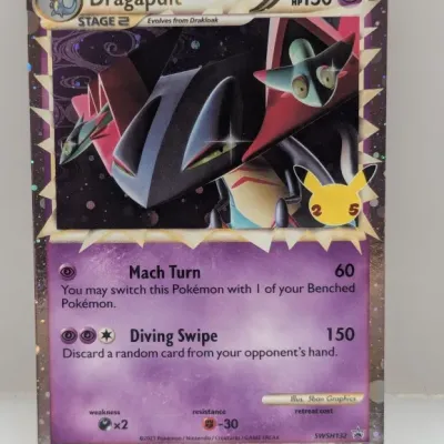 Sale Photo Thumbnail #630: Dragapult 25th Anniversary promo Pokémon card, SWSH132, featuring a holographic cosmos pattern border.