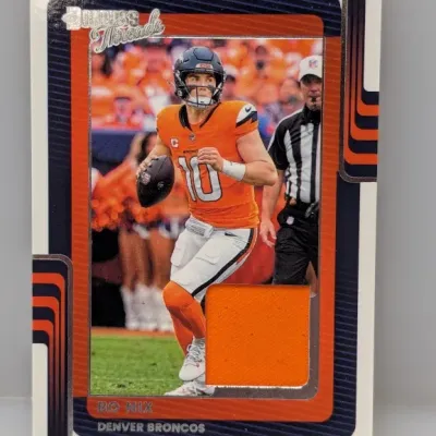 Sale Photo Thumbnail #767: Panini Donruss Threads Bo Nix Denver Broncos trading card featuring an embedded orange jersey relic patch.