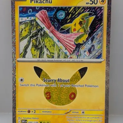 Sale Photo Thumbnail #139: Pikachu Pokémon trading card with a 30th-anniversary holographic design and artwork by Tomokazu Komiya.