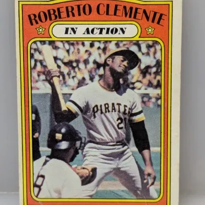 Sale Photo Thumbnail #361: 1972 Topps Roberto Clemente "In Action" baseball card (#310), featuring the Pittsburgh Pirates Hall of Famer in raw, vintage condition.