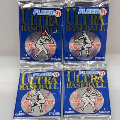 Sale Photo Thumbnail #441: Four unopened wax packs of 1991 Fleer Ultra Baseball trading cards, each containing 14 cards and 1 logo sticker.