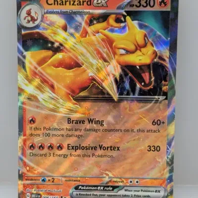Sale Photo Thumbnail #459: Pokémon Charizard ex double rare holographic trading card, set 006/165 from the 2023 Scarlet & Violet 151 expansion.